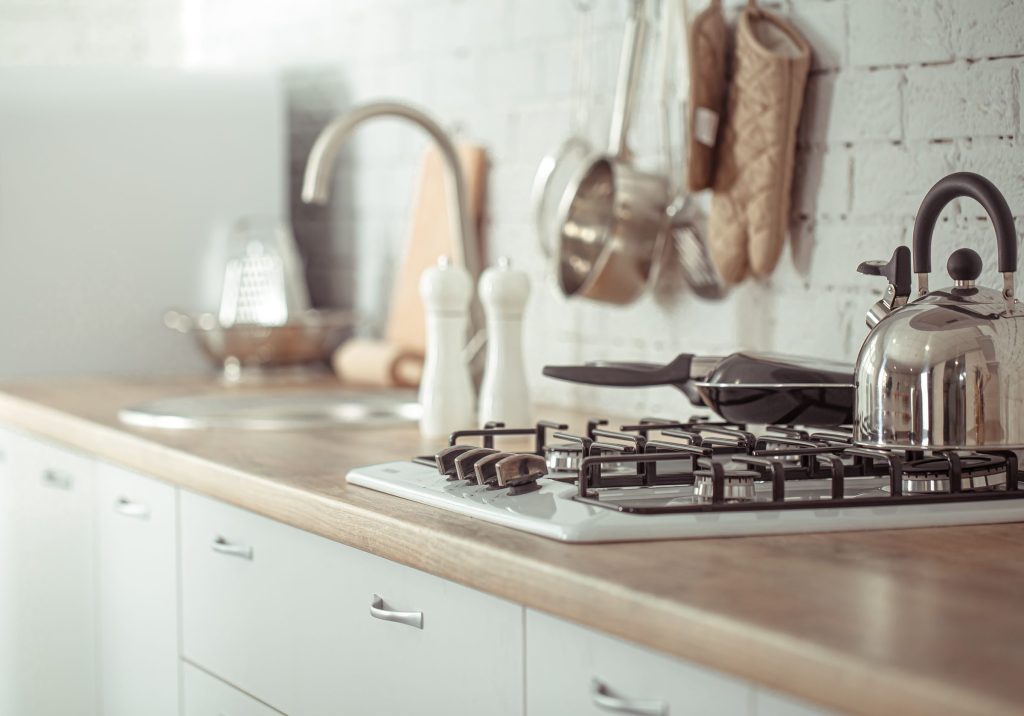 A gas hob on a wooden counter