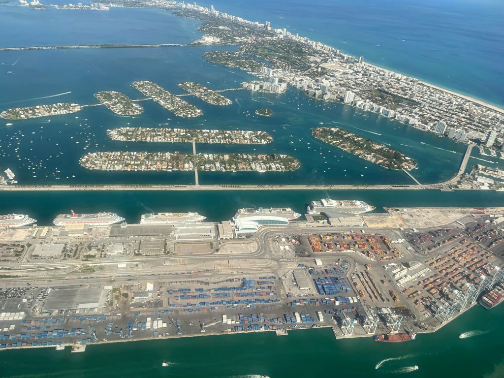 An aerial view of the bay islands with the port and the beach behind them